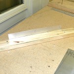 Timber ripped and screwed together sandwiching the stiffener which has already been bent to 90 degrees.